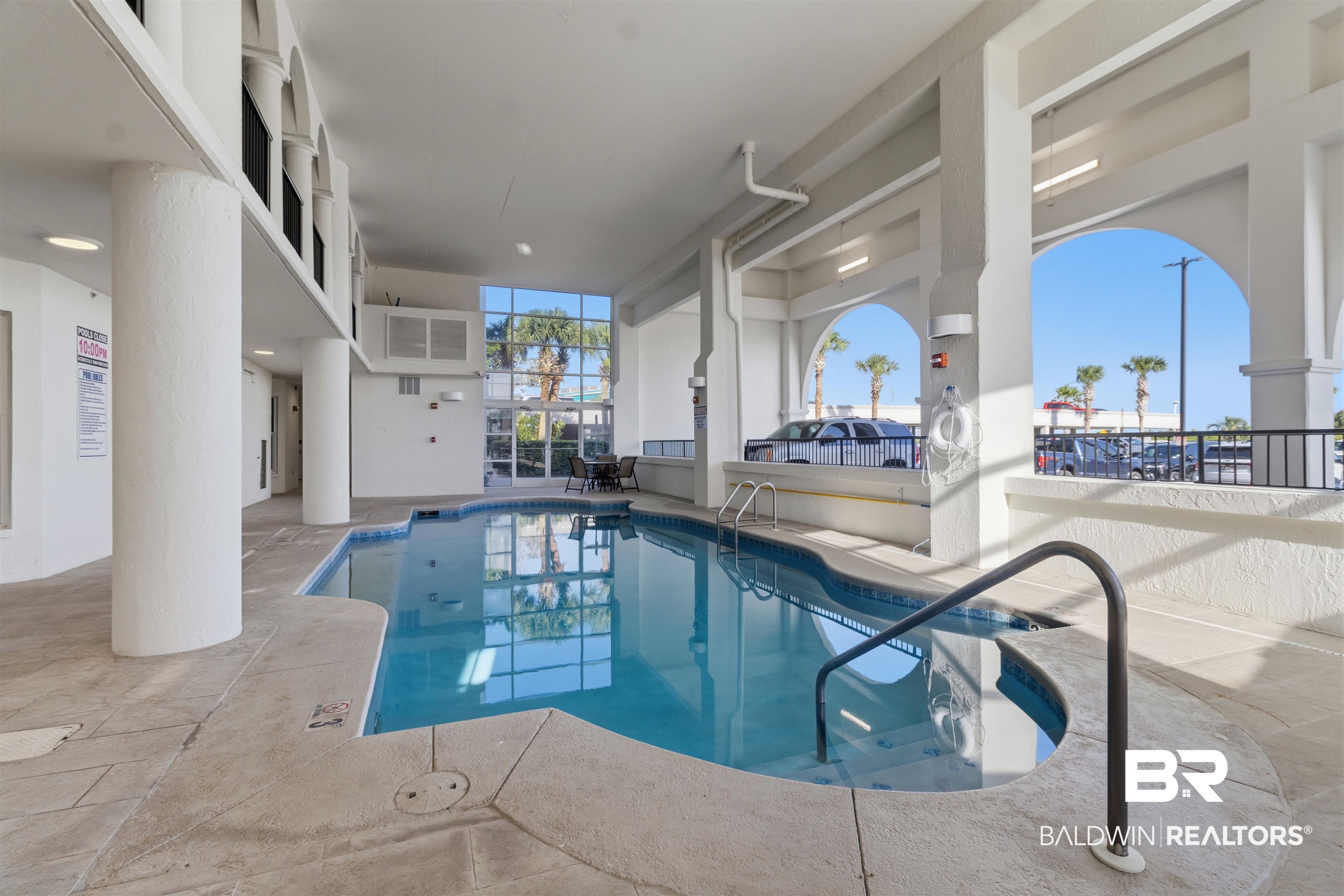 3564 Bayou Road, Unit 203 Orange Beach, AL 36561 - Photo 29 of 53 Indoor swimming pool featuring an integrated hot tub and tiled coping
