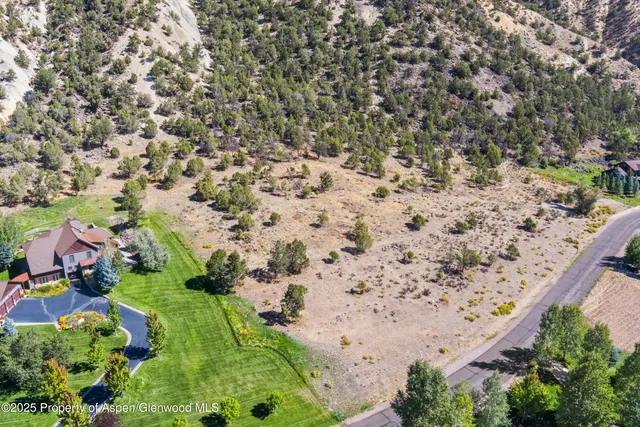an aerial view of house with yard