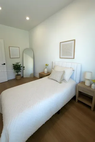 a bedroom with bed and window