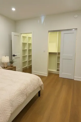 a bedroom with a bed and a cabinets