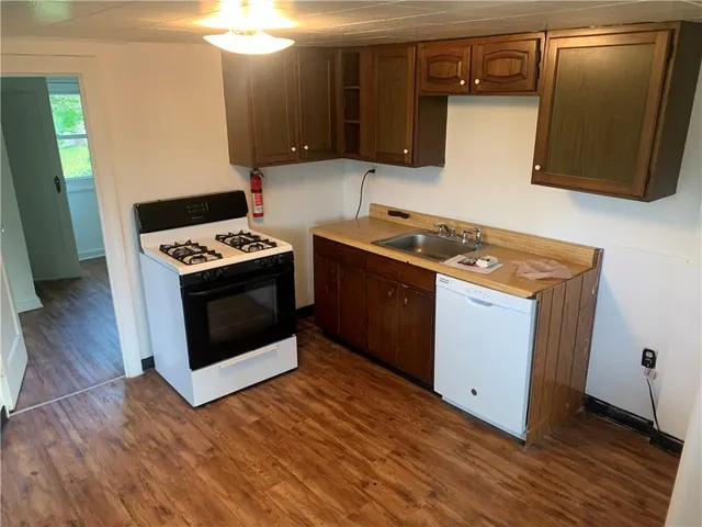 a kitchen with a stove and a microwave