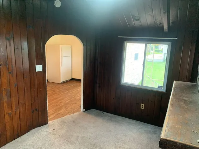 a view of a door and chair in wooden door