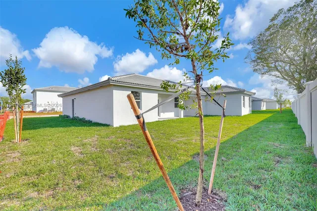 an empty room with a empty space and windows