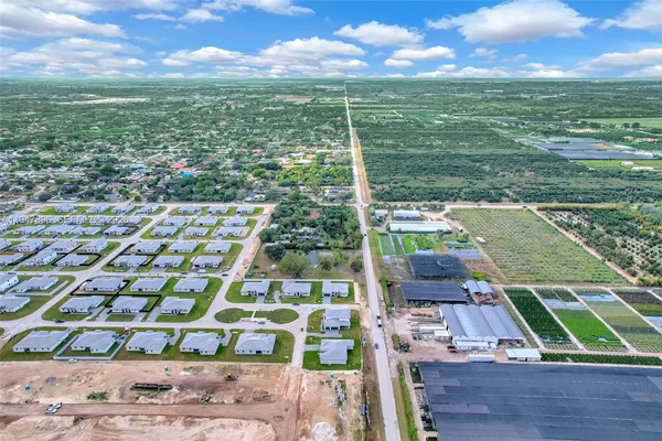 a bathroom with a sink a mirror and a shower