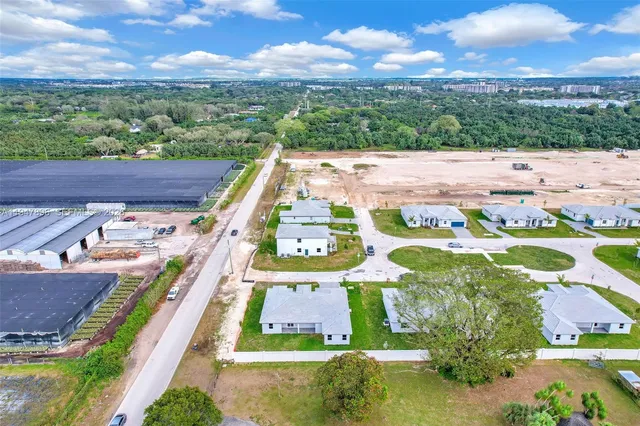 a view of a sink and cabinets in a room