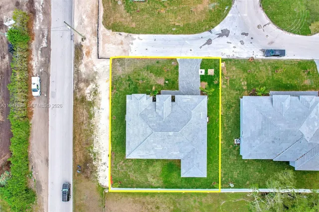 a bedroom with a bed and a potted plant
