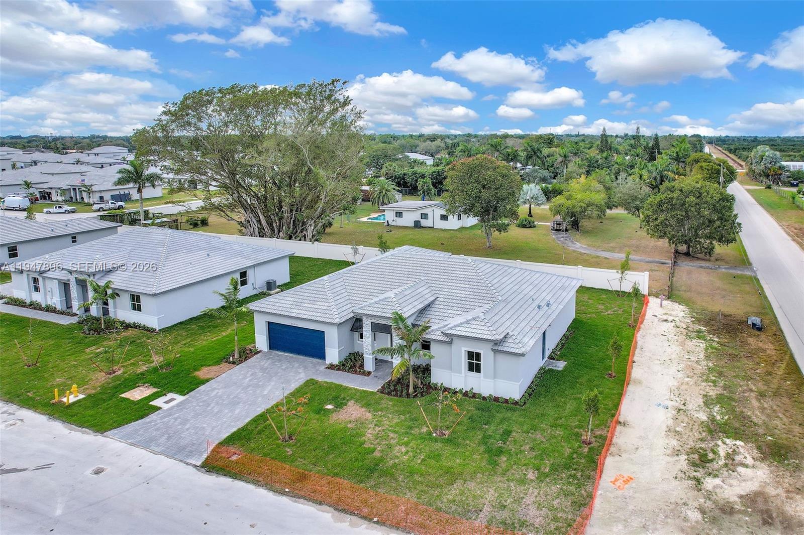 27210 Southwest 159th Path Homestead, FL 33031 - Photo 39 of 100 an aerial view of a house with a big yard