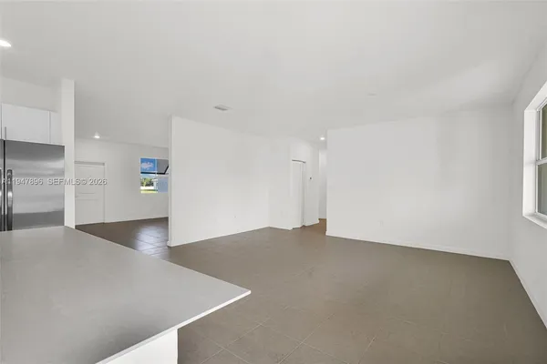 a view of an empty room with a window