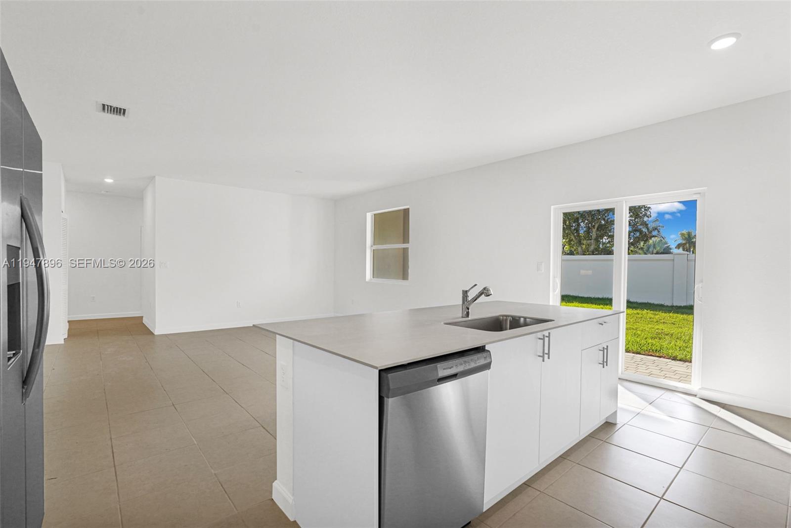 27210 Southwest 159th Path Homestead, FL 33031 - Photo 43 of 100 a kitchen with a sink and cabinets