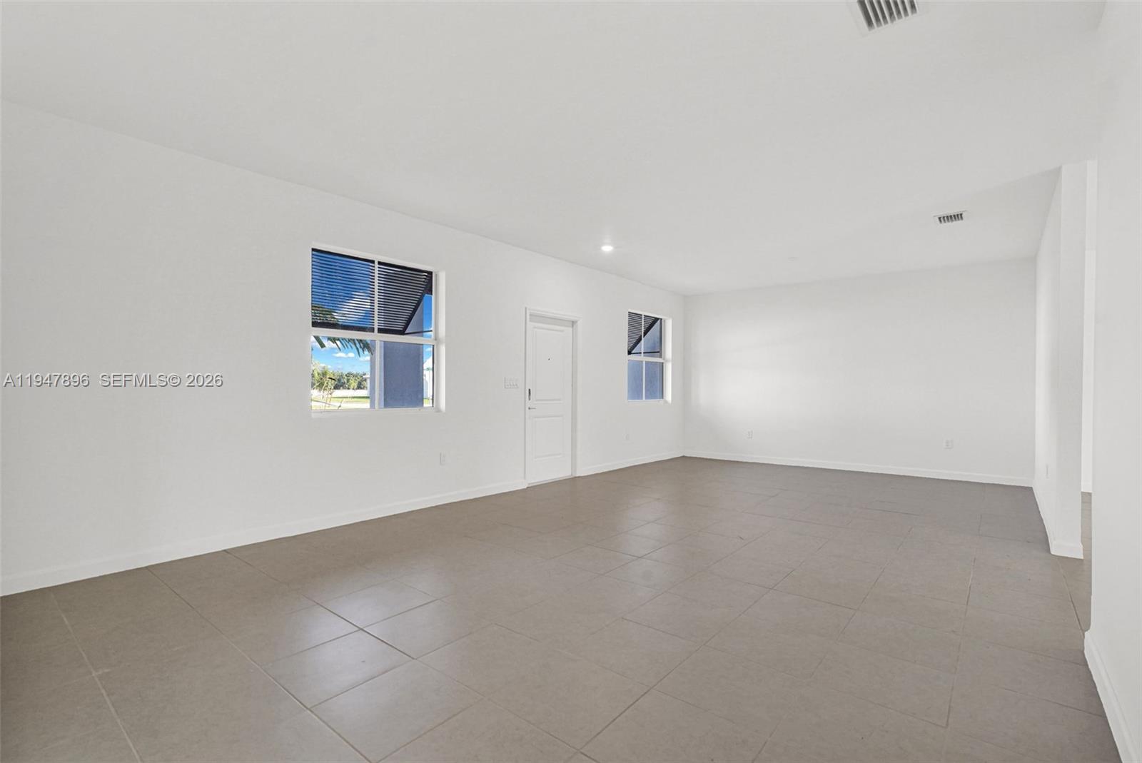 27210 Southwest 159th Path Homestead, FL 33031 - Photo 45 of 100 an empty room with windows