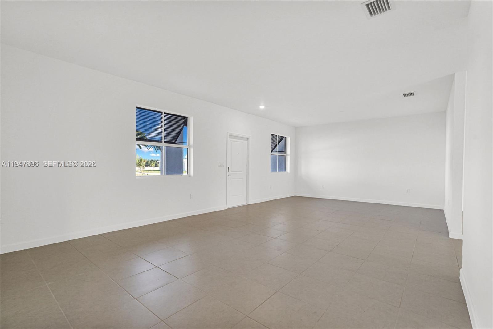 27210 Southwest 159th Path Homestead, FL 33031 - Photo 46 of 100 a view of an empty room with a window