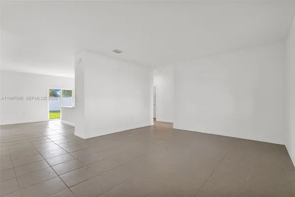 a kitchen with stainless steel appliances a stove a sink a microwave and cabinets