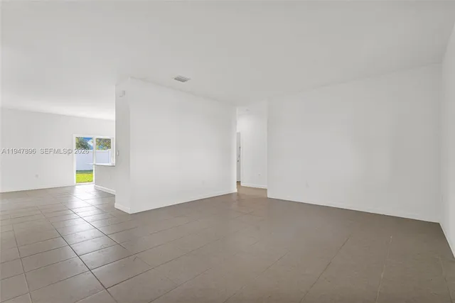 a kitchen with stainless steel appliances a stove a sink a microwave and cabinets