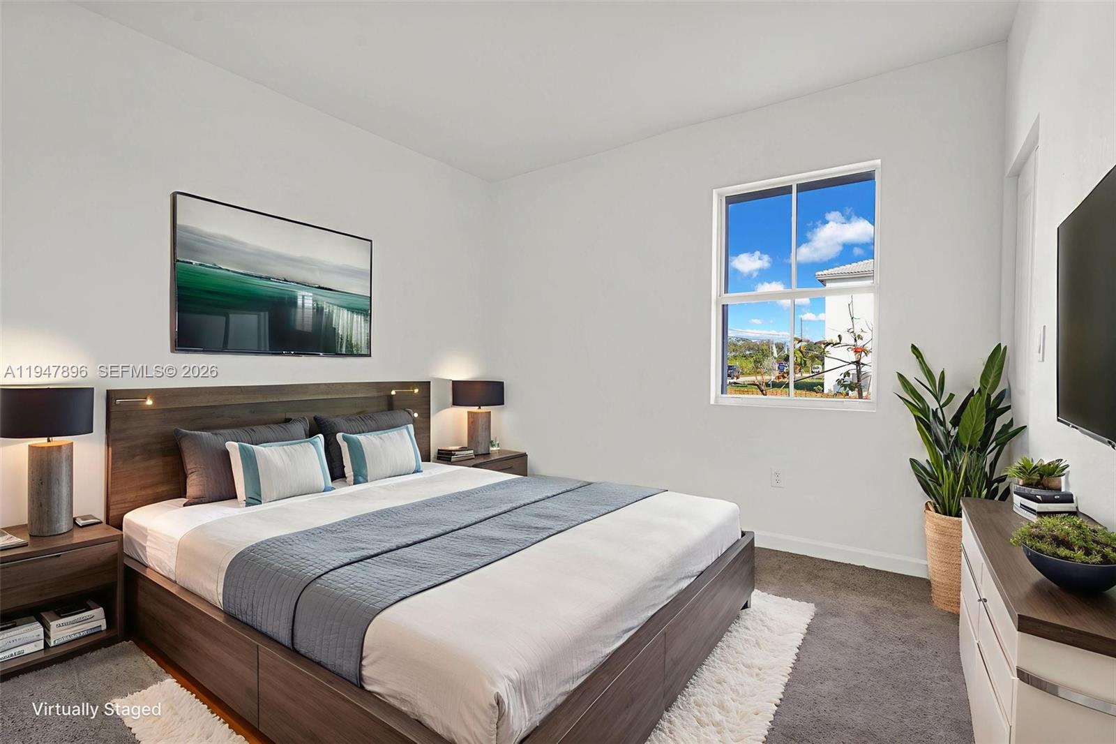 27210 Southwest 159th Path Homestead, FL 33031 - Photo 73 of 100 a bedroom with a bed and a potted plant