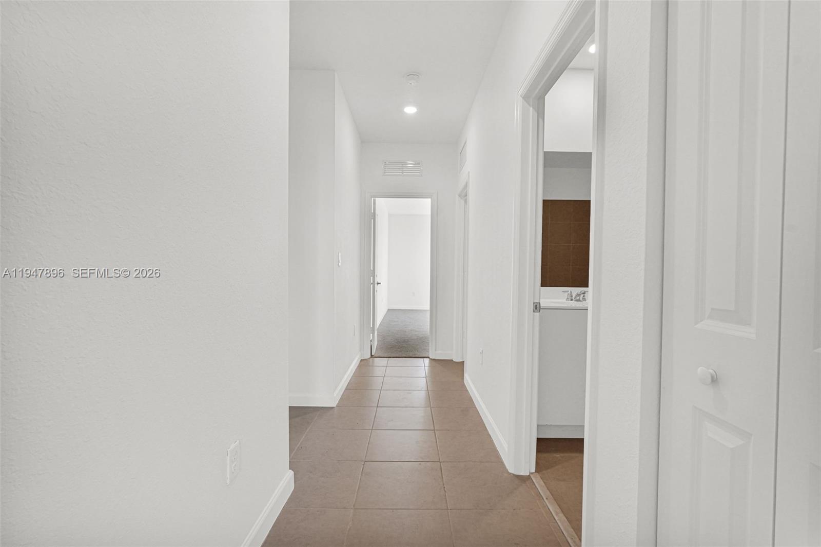 27210 Southwest 159th Path Homestead, FL 33031 - Photo 78 of 100 a view of a hallway with wooden floor