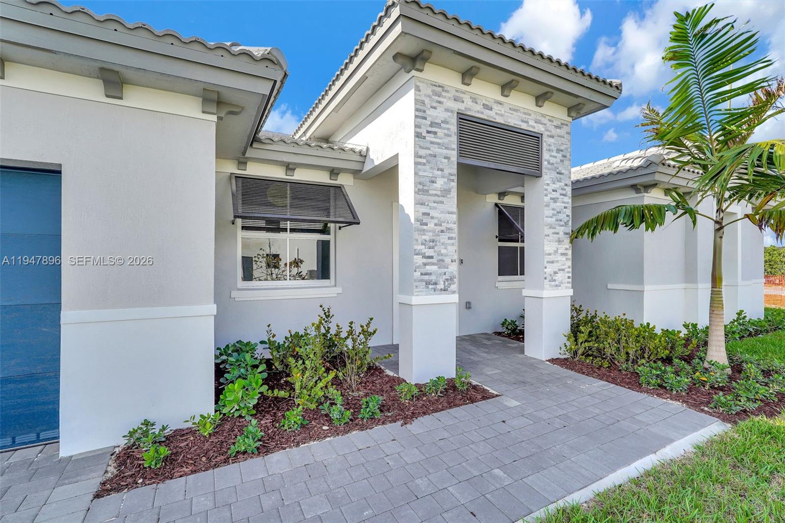 27210 Southwest 159th Path Homestead, FL 33031 - Photo 9 of 100 a front view of a house with a yard