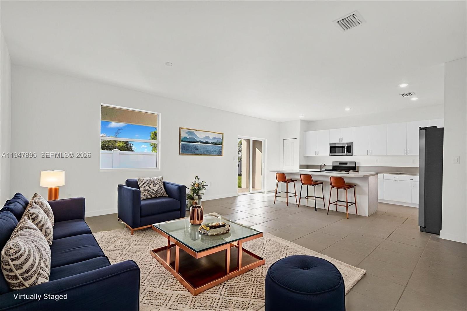 27210 Southwest 159th Path Homestead, FL 33031 - Photo 92 of 100 a living room with furniture and kitchen view