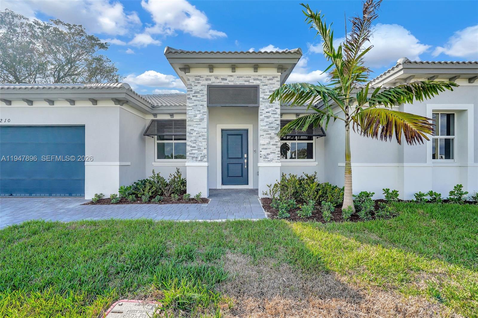 27210 Southwest 159th Path Homestead, FL 33031 - Photo 10 of 100 a front view of a house with a yard
