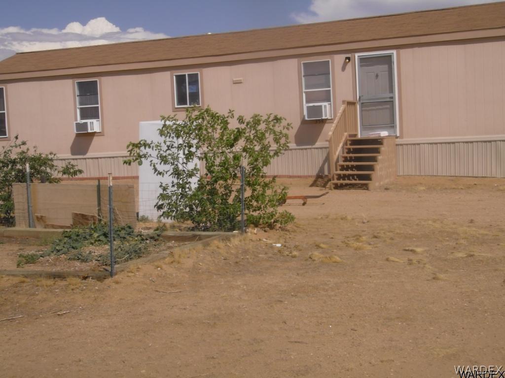 354 South Hope Road Golden Valley, AZ 86413 - Photo 1 of 12 front view of a house with a yard