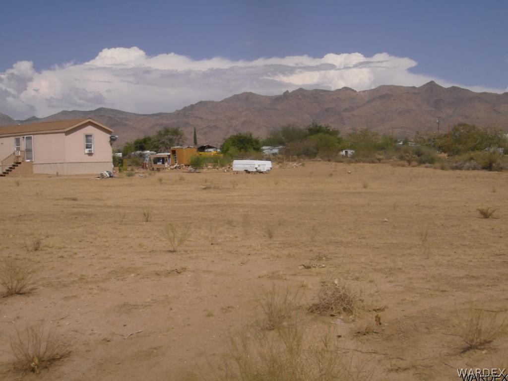 354 South Hope Road Golden Valley, AZ 86413 - Photo 2 of 12 a view of lake with mountain