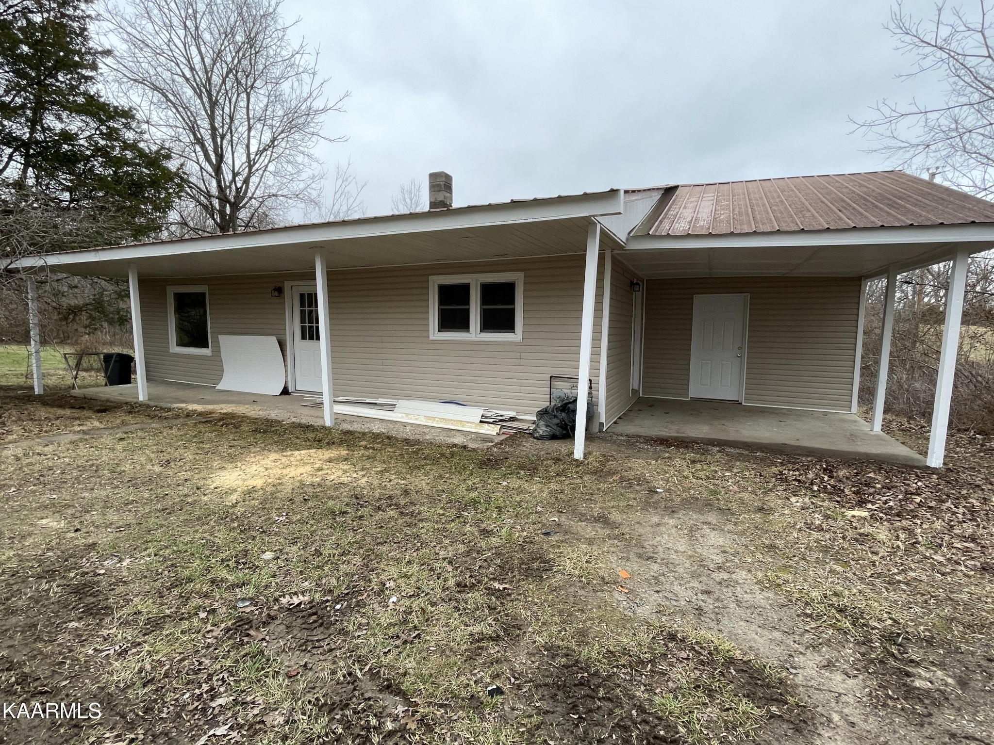 722 Yellow Cliff Road Jamestown, TN 38556 - Photo 2 of 13 a view of a house with a backyard