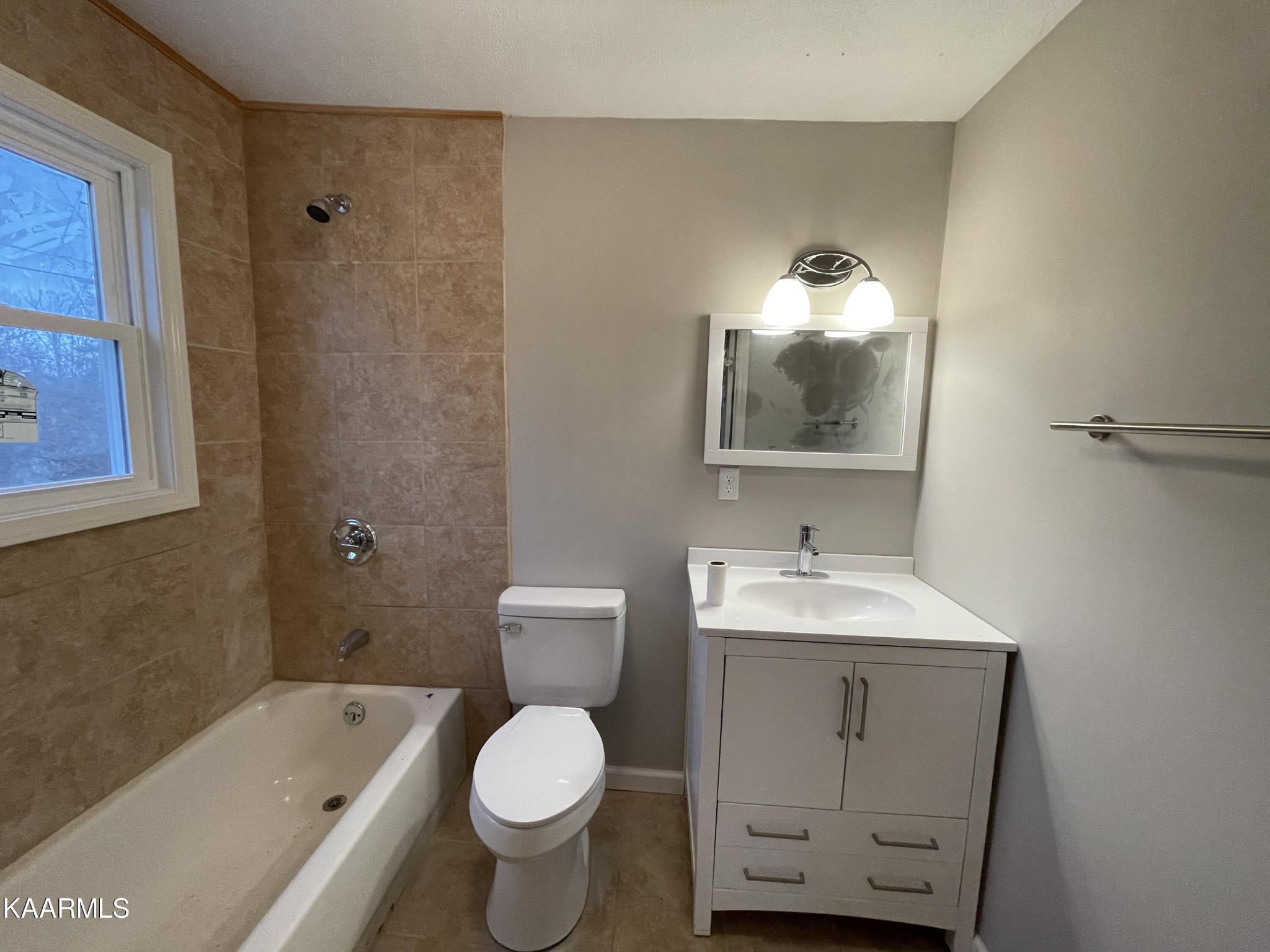 722 Yellow Cliff Road Jamestown, TN 38556 - Photo 8 of 13 a bathroom with a sink toilet and shower