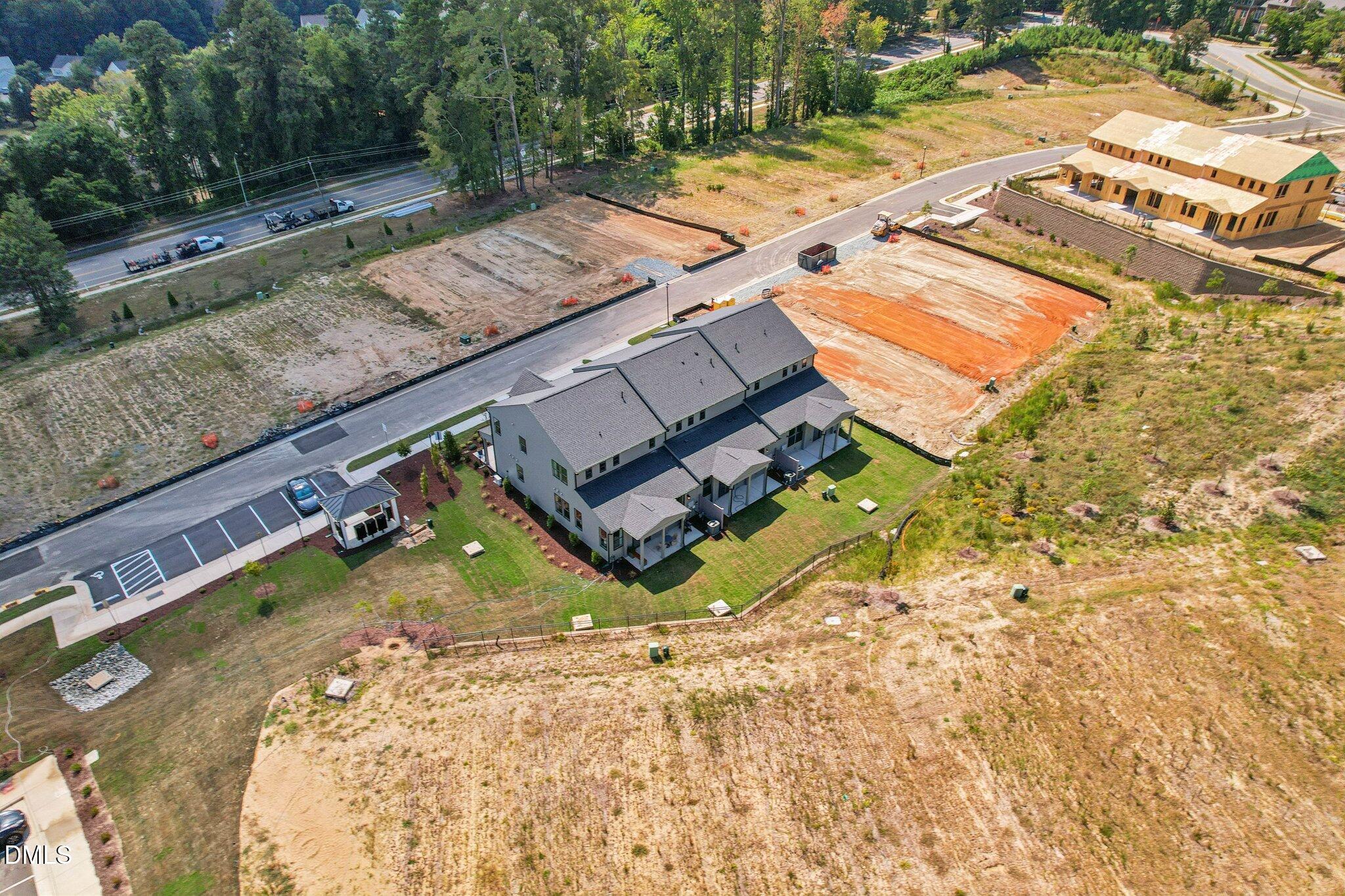 2124 Barrier Ridge Way Apex, NC 27502 - Photo 5 of 31 an aerial view of a house with a yard and lake view