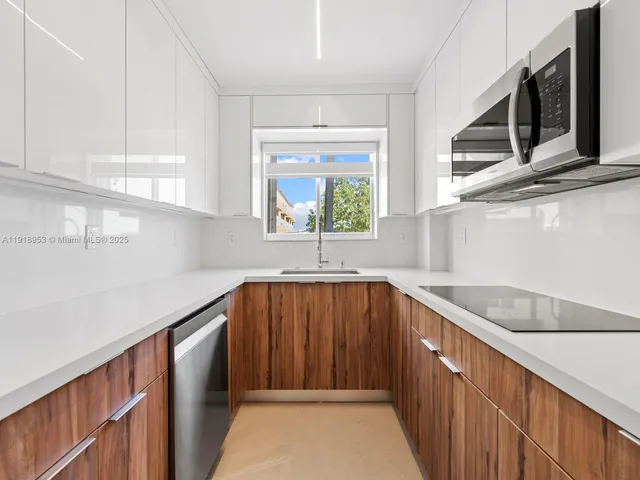 a view of a kitchen with furniture and window