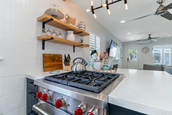a kitchen with a stove and cabinets