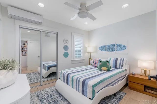 a bedroom with a bed and a couch