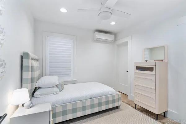 a bedroom with a bed and a cabinets