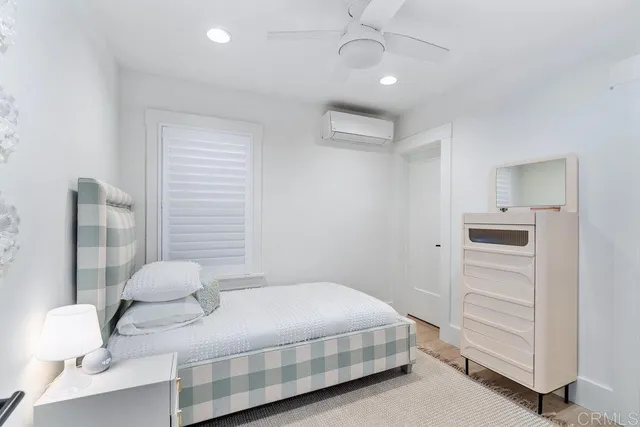 a bedroom with a bed and a cabinets