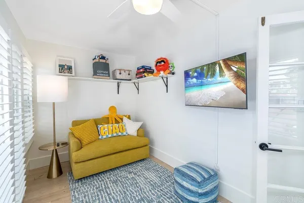 a living room with furniture and a rug