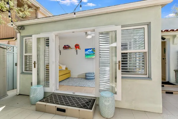 a bathroom with a glass door shower and yard