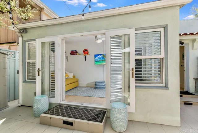 a bathroom with a glass door shower and yard