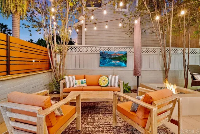 a view of a patio with table and chairs and potted plants