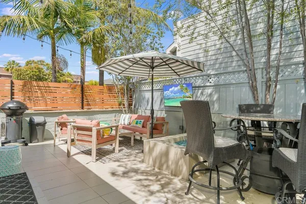 a view of a dining room with furniture and a rug