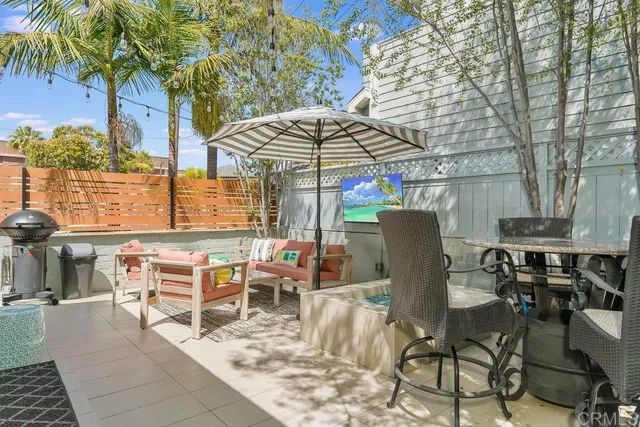 a view of a dining room with furniture and a rug