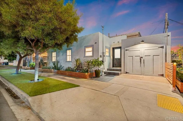 a view of a house with backyard porch and sitting area