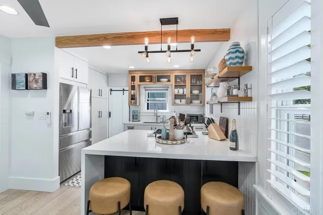 a kitchen with a table and chairs
