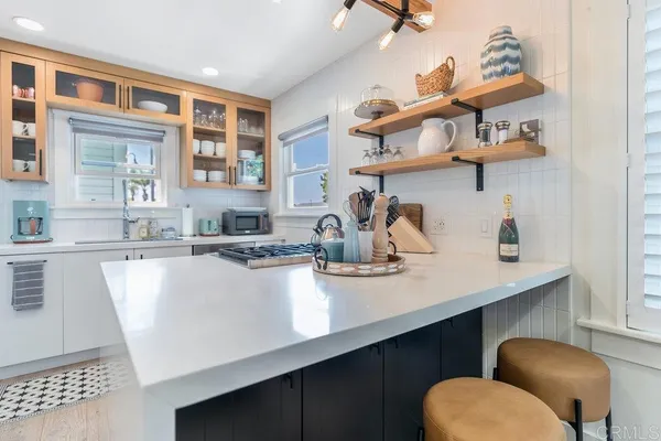 a kitchen with a table and chairs in it