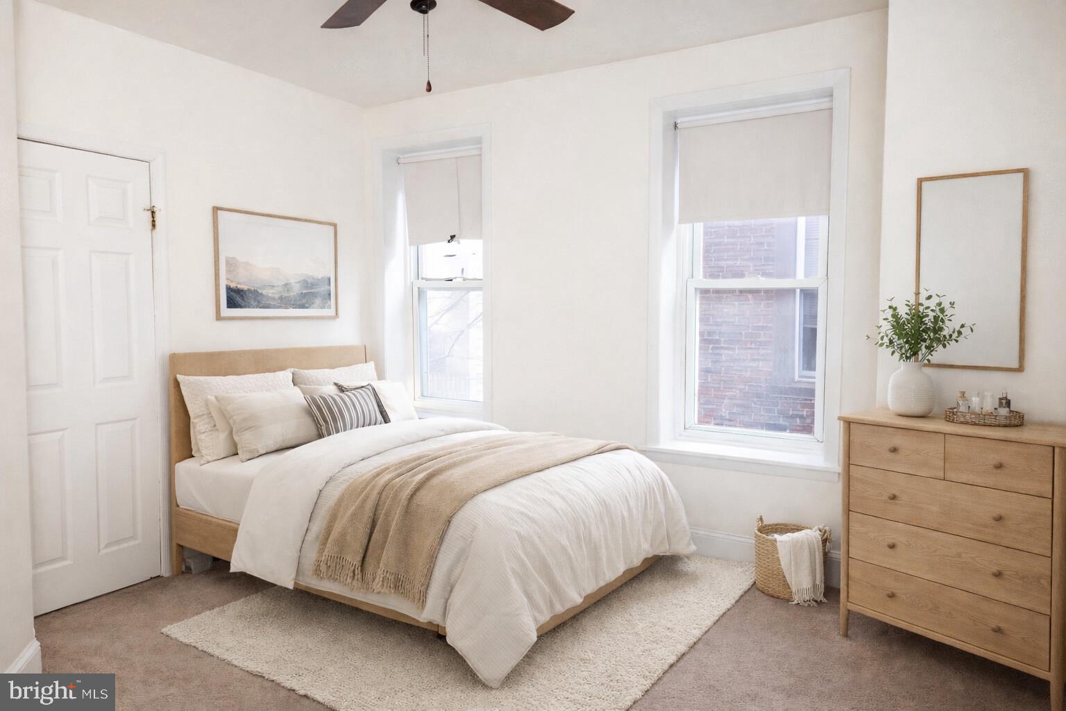 2309 East York Street, Unit 2R Philadelphia, PA 19125 - Photo 2 of 8 a bedroom with a bed and a dresser