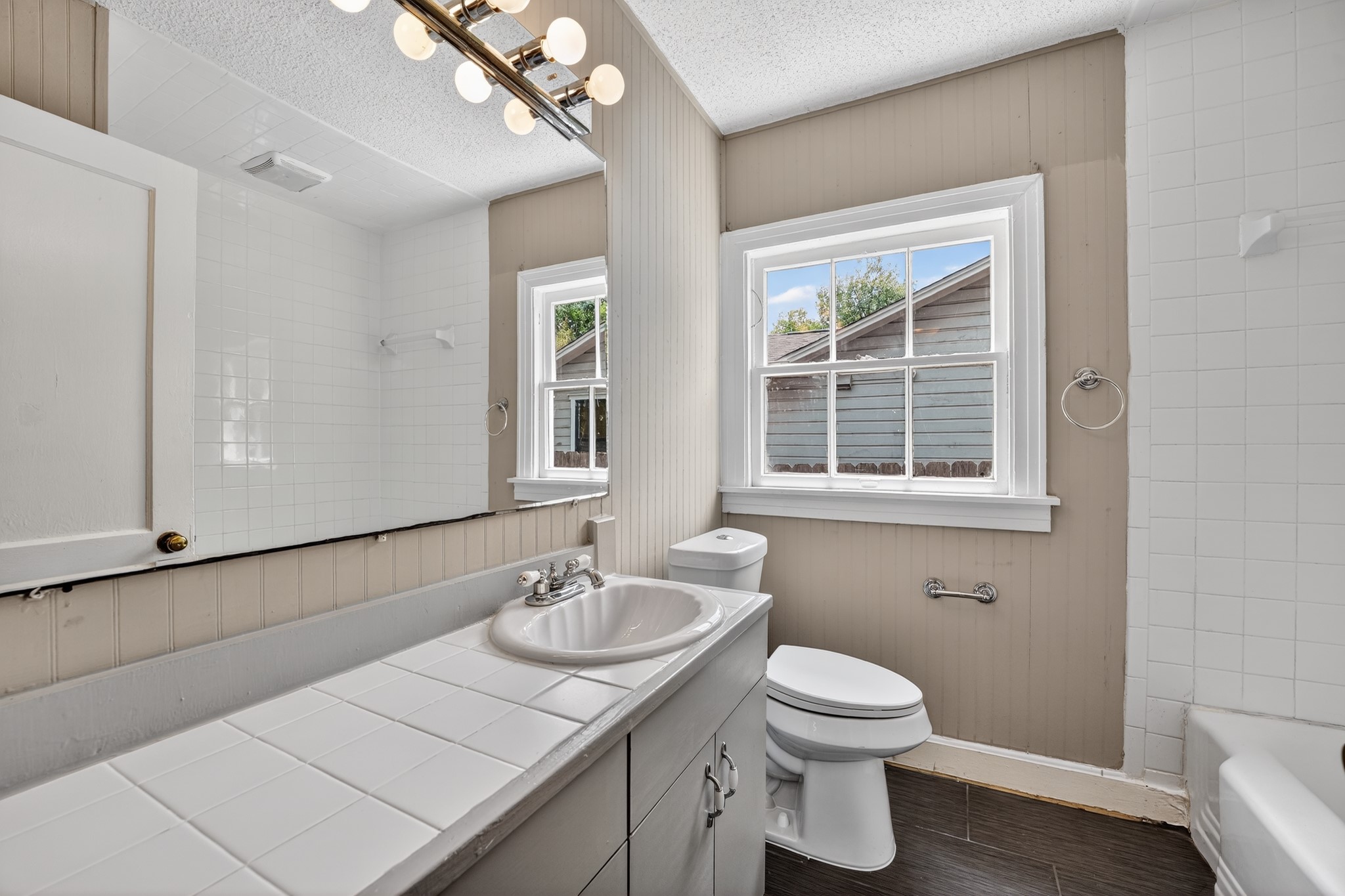 4907 Duval Street Austin, TX 78751 - Photo 19 of 31 a bathroom with a sink and a toilet