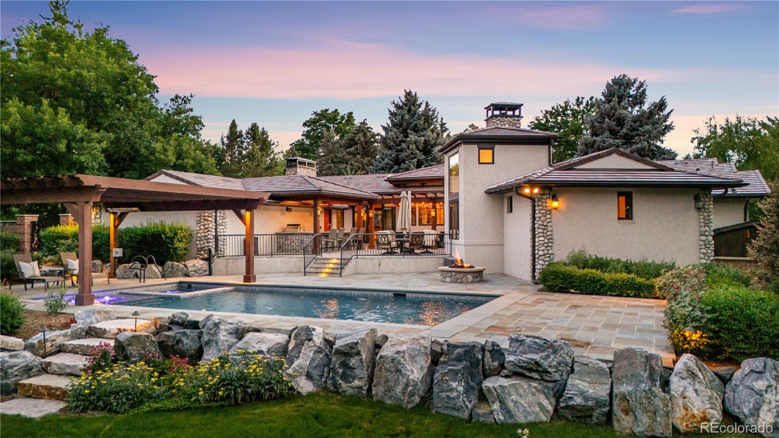 2305 Cherryville Road Greenwood Village, CO 80121 - Photo 1 of 50 a front view of house with yard and outdoor seating