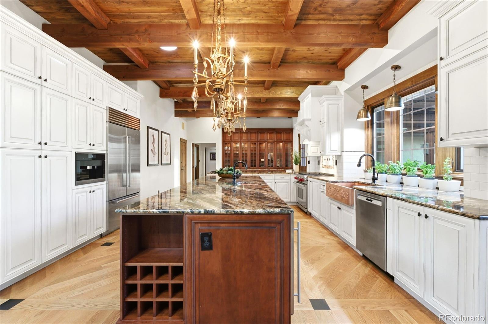 2305 Cherryville Road Greenwood Village, CO 80121 - Photo 11 of 50 a kitchen with stainless steel appliances granite countertop a sink and cabinets