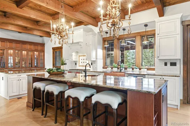 a large kitchen with a counter space a sink and appliances