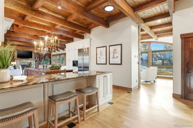 a open kitchen with stainless steel appliances granite countertop a sink and cabinets