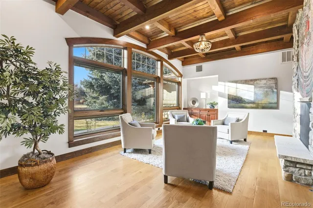 a living room with a large window and a table