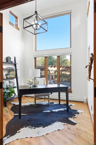 a living room with furniture a table and a window
