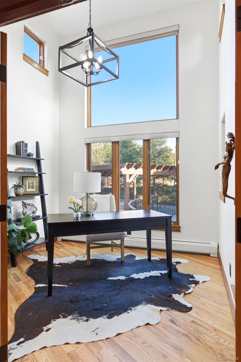 2305 Cherryville Road Greenwood Village, CO 80121 - Photo 23 of 50 a living room with furniture a table and a window